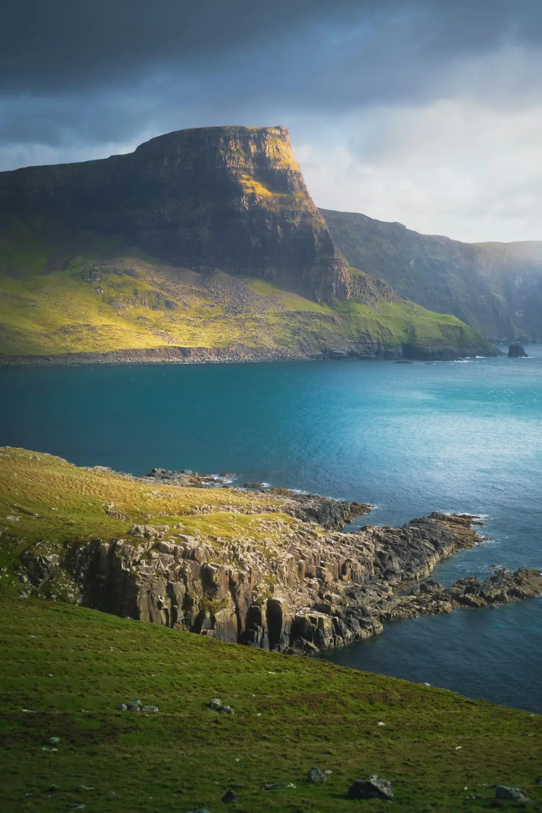 Waterstein Head on Skye dropping to deep blue water